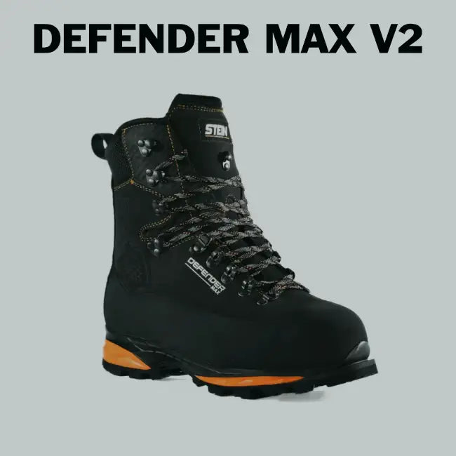 Black defender max v2 hiking boot with orange accents on the sole and heel, featuring durable leather upper and metal eyelets.