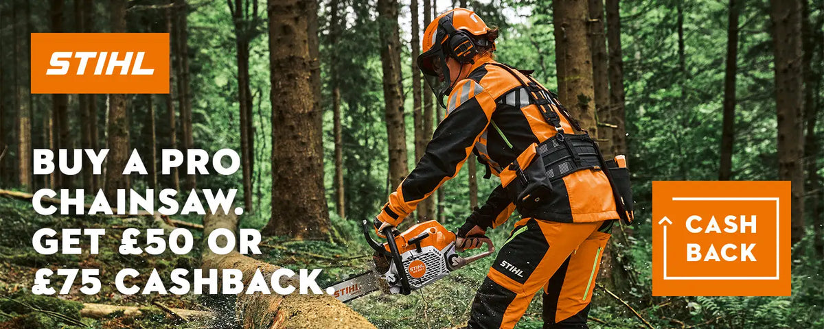 Orange and black stihl pro chainsaw with a visible chain, held by a worker in matching protective gear.